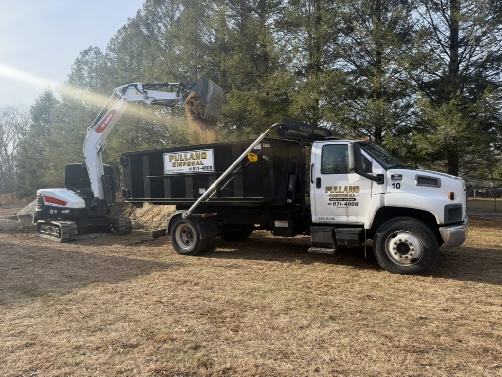Pullano Disposal truck loading debris